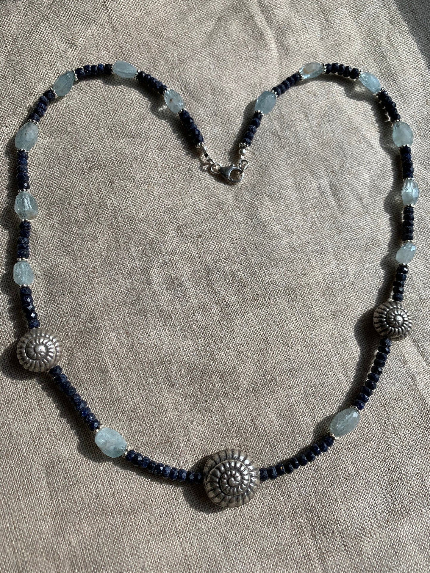 Necklace “Spiral Deep” Sapphires, Aquamarine, Fine Silver Shell focal beads, Statement Piece, gift idea, March & September birthstone